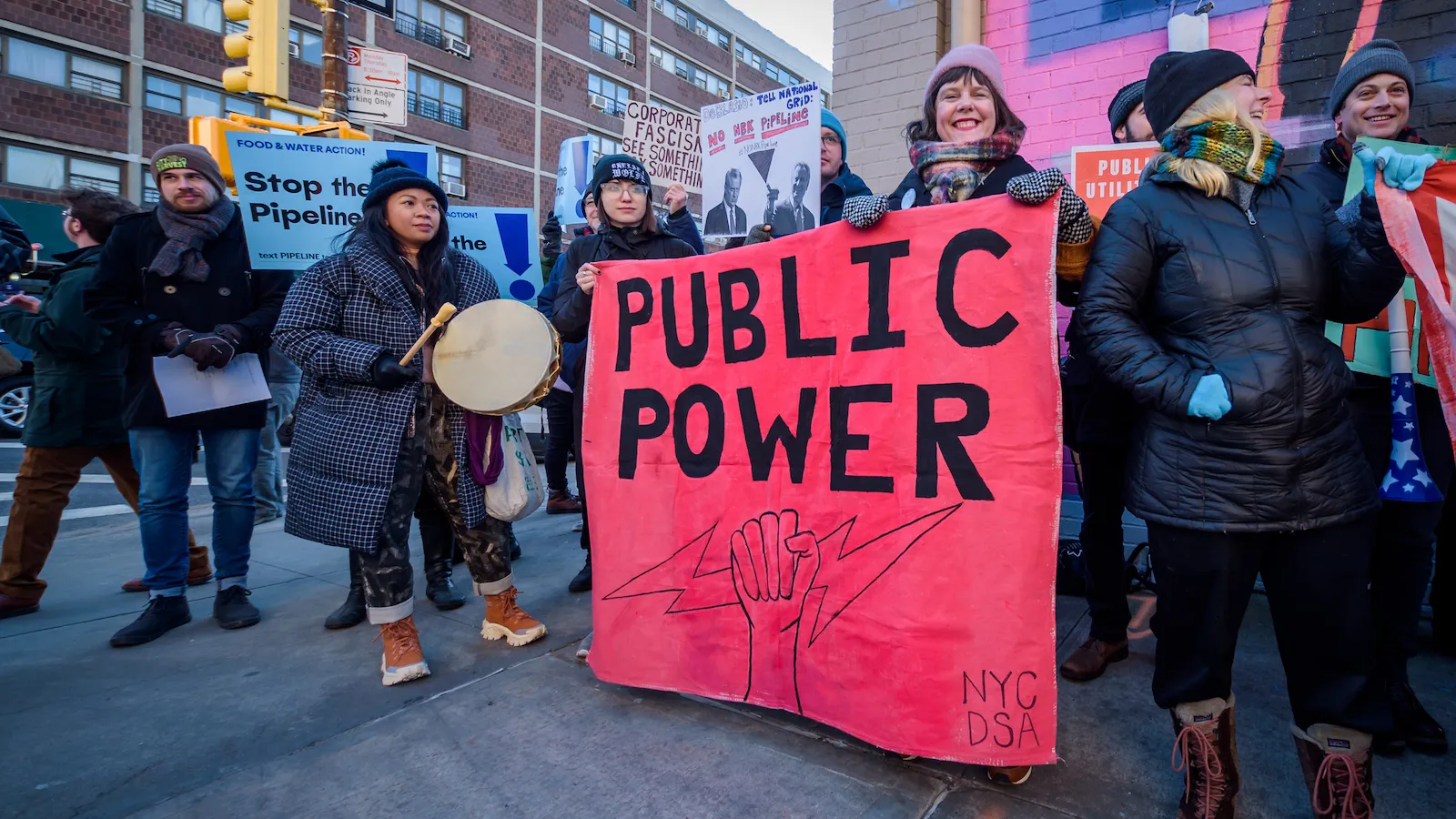 BROOKLYN, NEW YORK, UNITED STATES - 2020/02/15: Protesters holding a Public Power banner at the rally. Community members from across North Brooklyn rallied at Manhattan Avenue and Moore Street near the construction site of National Grid’s controversial Metropolitan Reliability Infrastructure (MRI) project shutting down construction for the day. Community calls for immediate, permanent halt of construction and on Mayor De Blasio, and Governor Cuomo to oppose project. (Photo by Erik McGregor/LightRocket via Getty Images)